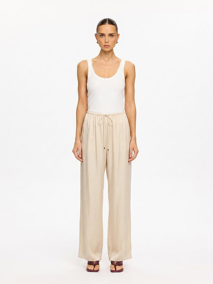 KIVARI Blythe Pant in Champagne – front-facing product photo with white tank top
