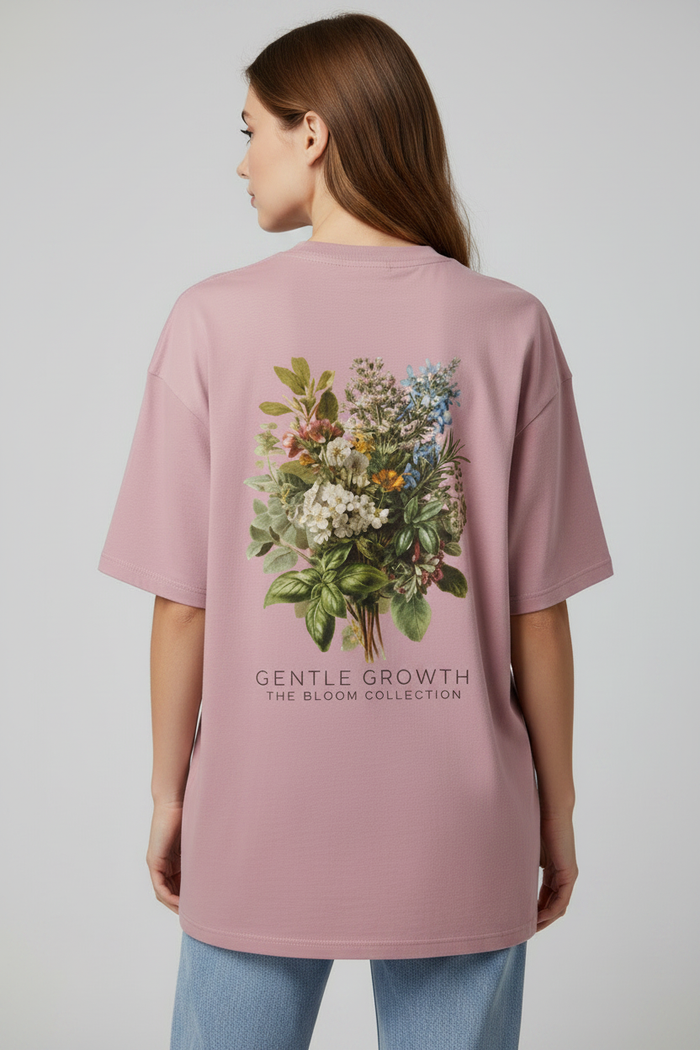 Female model back view Gentle Growth tee with jeans