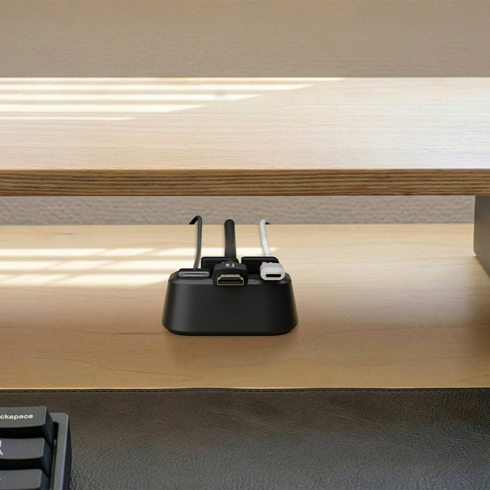 APP11145 - Magnetic Cable Holder | LD103 showing the magnetic cable holder organizing multiple cables beneath a wooden desk shelf