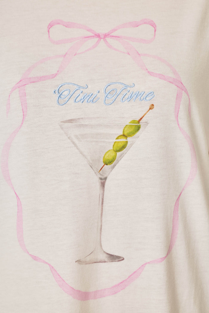 The Olive You Martini Print Nightshirt by P.J. Salvage features a drawing of a martini glass with three green olives on a stick, surrounded by a pink ribbon design and the words "Tini Time" written above in blue script.