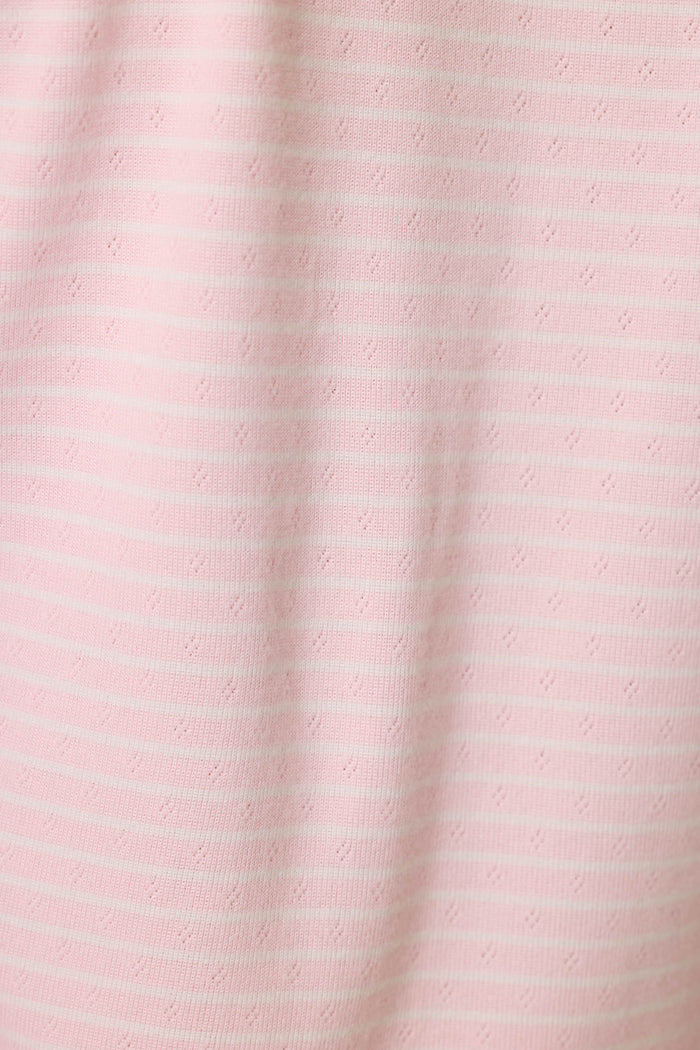 The Pretty Stripes Tender Pink Pointelle  fabric is light pink with subtle horizontal white stripes and delicate dotted patterns, offering a soft texture perfect for comfortable loungewear.