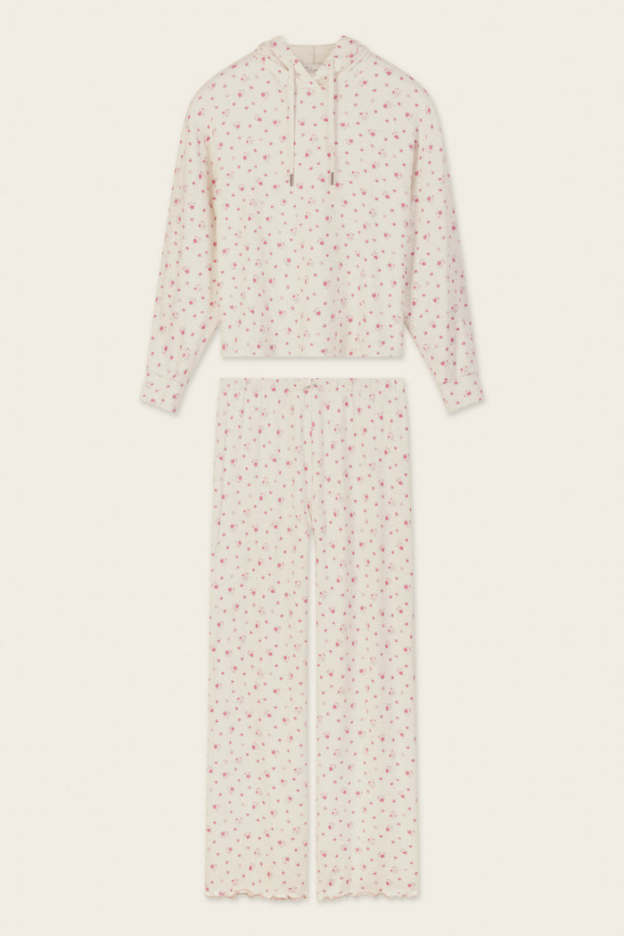 The Romantic Rose Ditsy Rose Print Hoodie & Pants PJ Set by P.J. Salvage is a cream-colored pajama set with a hooded long-sleeve top and wide-leg pants, both adorned with a delicate pink floral print pattern. The set is displayed flat on a light background.
