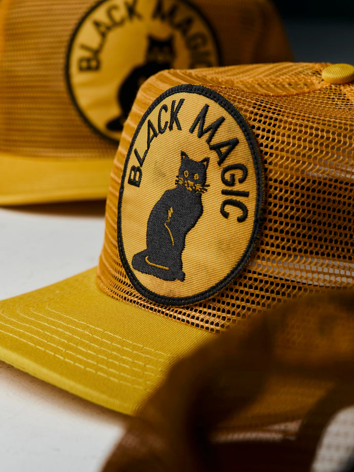 Black the "black magic" mesh trucker